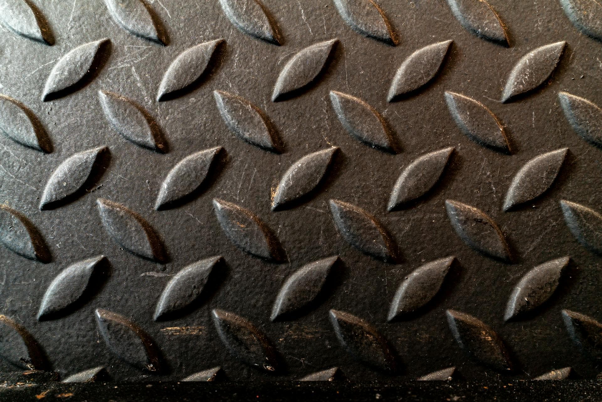 PVC and rubber industrial floor mats side by side in a factory